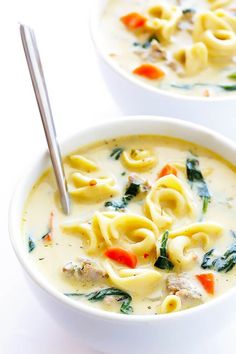 two bowls filled with pasta and meat soup