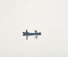 two people in a boat floating on top of the water with no one around them