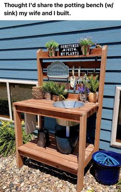 an outdoor potting bench made out of wood with plants growing on it and the words, thought i'd share the potting bench w /