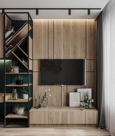 a living room with wooden shelves and a flat screen tv mounted on the wall above it