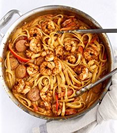 creamy cajun shrimp pasta with sausage in a skillet