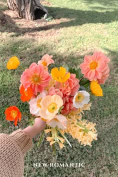 a person holding a bouquet of flowers in their hand with the words new romantic on it