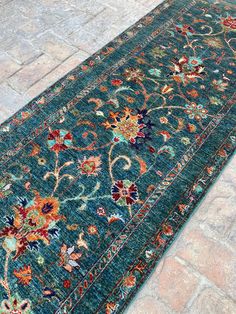 Designed by KuzuRugs Materials: Wool Width: 2.8 feet Length: 8.6feet About this item * Details of this Gorgeous Handmade Afghan Sultani Runner Rug. * Size in feet : 2.8 x 8.6 feet * Size in cm : 84x 262 cm * Knots : 150 kpsi * Condition : New * This gorgeous Runner Rug has an incredible Sultani Floral Design, Finely woven in beautiful colors on an eye-soothing Green  base. * Colors present in the rug such as Golden, Turquoise, Olive Green, Dark Tangelo, Indigo Blue, Green  - all made from Natura Corridor Runner, Runner Entryway, Corridor Rug, Runner Hallway, Green Carpet, Hallway Runner, Carpet Runner, Entryway Rug, Green Dark