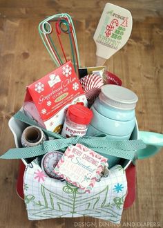 a basket filled with lots of items on top of a wooden floor