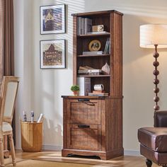 a living room with a chair, table and bookshelf