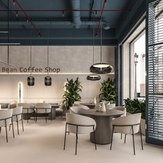 the interior of a coffee shop with tables and chairs