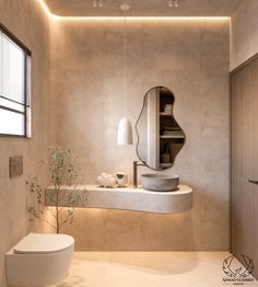 a bathroom with a toilet, sink and mirror in it's center wall is lit by recessed lights