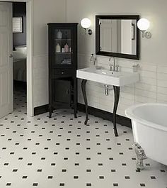 a bathroom with a sink, mirror and bathtub in white and black tile flooring