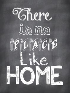 there is no place like home written in chalk on a blackboard with white lettering