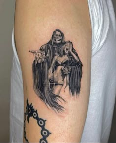 a woman with a skeleton tattoo on her arm