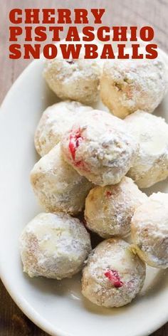 cherry pistachio snowballs on a white plate with text overlay that reads cherry pistachio snowballs