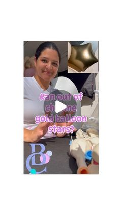 a woman sitting at a table in front of balloons