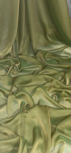 an image of a bed with green sheets