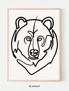 a black and white drawing of a bear's head on a wooden framed wall