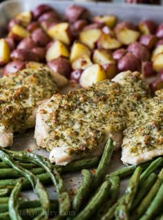 chicken, potatoes and green beans on a baking sheet