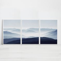 three paintings with mountains in the background