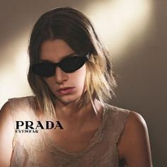 The new Prada Symbole sunglasses reinterpret the narrow oval shape with a contemporary flair. Fine faceted temples recreate the triangle shape featuring the Prada iconic logo. Edgy Hair, Mens Lifestyle, Cool Sunglasses, Women Essentials, Women Life