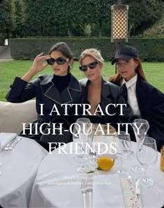 two women sitting next to each other at a table with wine glasses on it and the caption reads, i attract high - quality friends