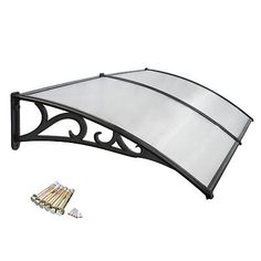 a black and white awning over a table with four pieces of screws on it