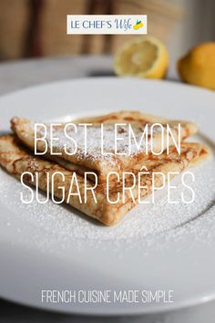 two lemon sugar crepes on a white plate with the words best lemon sugar crepes