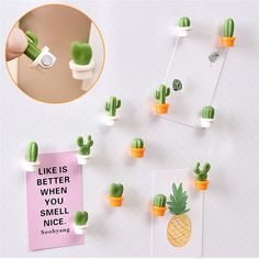 there is a pineapple and cactus magnets in the shape of succulents