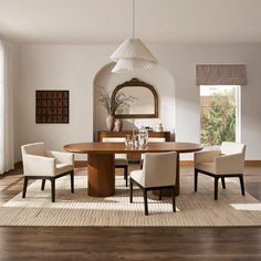 a dining room table with chairs around it