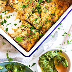 a casserole dish with broccoli and other toppings next to it