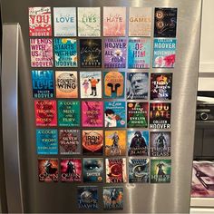 a refrigerator covered in lots of books and magnets