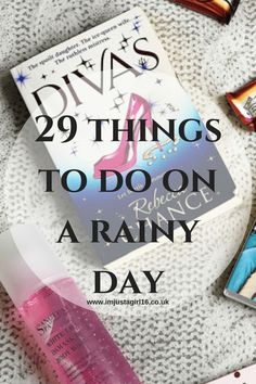 an open book and some candy on top of a bed with the title 29 things to do on a rainy day