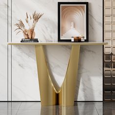 a table with a vase and some plants on it in front of a marble wall