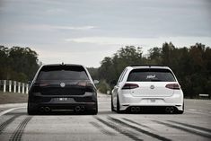 two cars parked side by side on the road