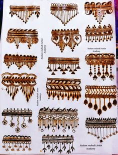 an assortment of different types of necklaces and earring clips on display in a shop window