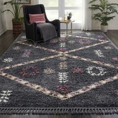 a living room area with a chair and rug