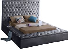 a bed with an upholstered headboard and foot board is shown in front of a white background