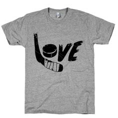 a grey t - shirt with the word love written in black on it and an image of