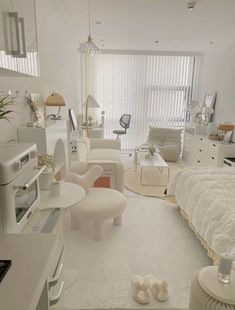 a white bedroom with lots of furniture in it