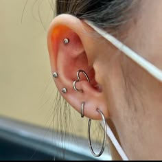 a woman with ear piercings on her ears