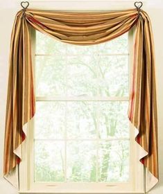 a window with a curtain hanging from it's side