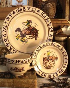 three plates and two bowls on top of a table