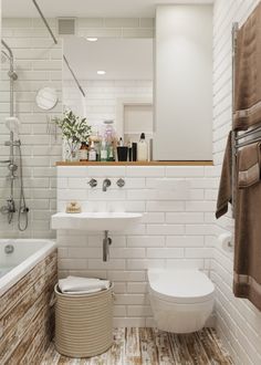 a bathroom with a toilet, sink and bathtub