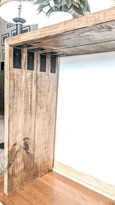 a wooden bench with metal brackets on it