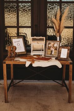 a table with pictures and other items on it