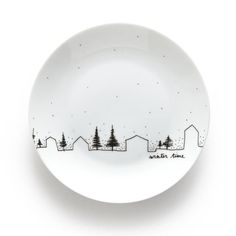 a white plate with black trees on it