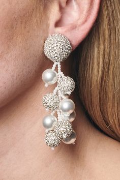 The intricate and precise thread work found in all of our accessories can only be accomplished by our most skilled, second-generation artisans who have cultivated their talents over decades. Details: Clip backing Style #J18E24-963 Luxury Festive Pearl Earrings With Intricate Design, Elegant Pearl Embellished Dangle Chandelier Earrings, Elegant Beaded Clip-on Earrings For Wedding, Chic White Pearl Embellished Earrings, Luxury Pearl-embellished Earrings For Party, Coconut Earrings, Diy Jewelry Unique, Thread Earrings, Handmade Fashion Jewelry