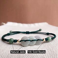 🍀 Bead Materials ：Real Jade & 14k gold bead 🍀 personalized：【yes 】➜Please feel free to contact me. 🍀 Rope colors：Other colors are available，Just give messages and tell me which color do you like. 🍀 length：This adjustable bracelet is suitable for most people, and you can also tell me the net size of you wrist (When measuring, please fit the skin without leaving a gap), I will make the perfect size for u. 🍀The dainty bracelet could be a great gift for your friends and family, wishing them Future Board, Lucky Gifts, Coin Bracelet, Wire Ring, Dainty Bracelet, Jade Bracelet, Dainty Bracelets, Jade Jewelry, Beaded Material