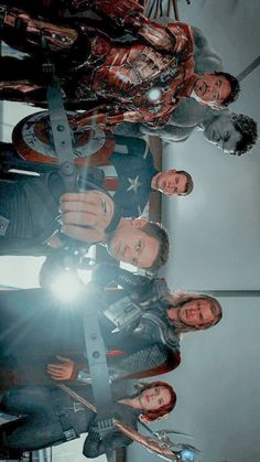 the avengers team is posing for a photo