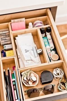 an open drawer filled with lots of office supplies