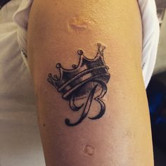 a tattoo with a crown on it