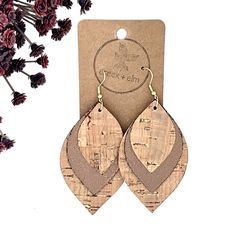 The Macy. What can we say? Beautiful and bold, these big dangly earrings are sure to stand out in a crowd. They are the perfect complement to any outfit to complete the rustic-chic look you're going for. Handcrafted with care and precision, Macys are built to last. With three distinct leaf cut-outs, made from both cork and faux leather, they are eco-friendly AND vegan so you are doing your part to make the world a better place. This version is very tan and very understated. The Macy is available Rustic Drop Earrings, Faux Leather Crafts, Vinyl Earrings, Cricut Earrings, Christmas Jewelry Diy, Cork Earrings, Diy Leather Earrings, Gold Leaf Earrings, Polymer Clay Jewelry Diy