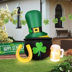 an inflatable st patrick's day hat and beer mug on the lawn